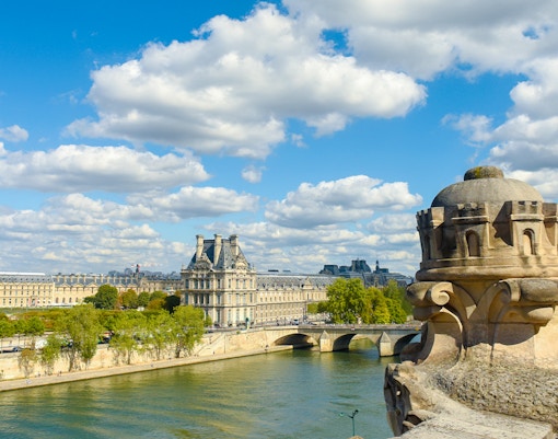 View from Orsay Museum terrace overlooking Paris cityscape and Seine River.