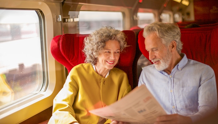 Senior couple travelling first class seats with Interrail