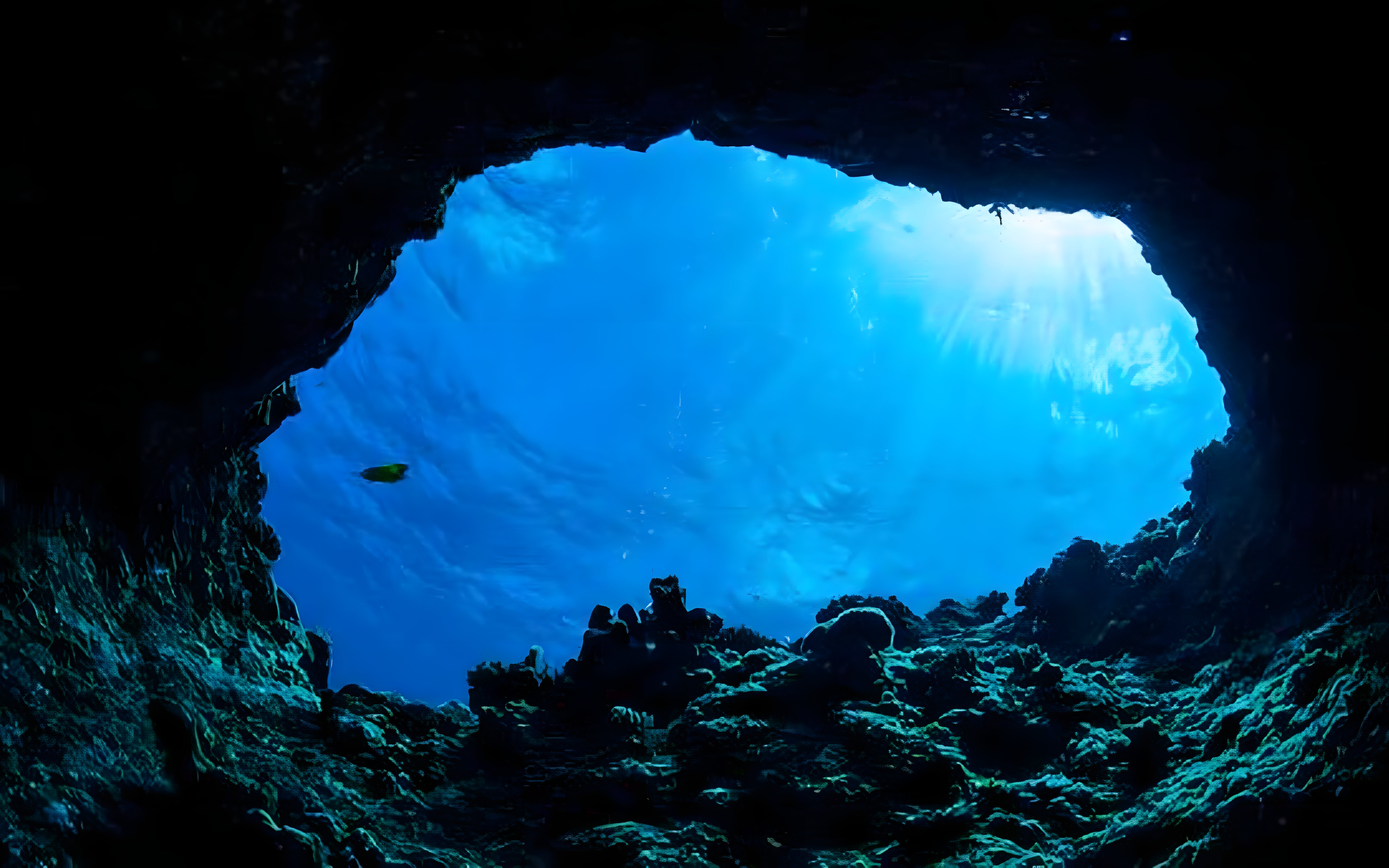 Blue cave interior with sunlight filtering through water, Koločep, Croatia.