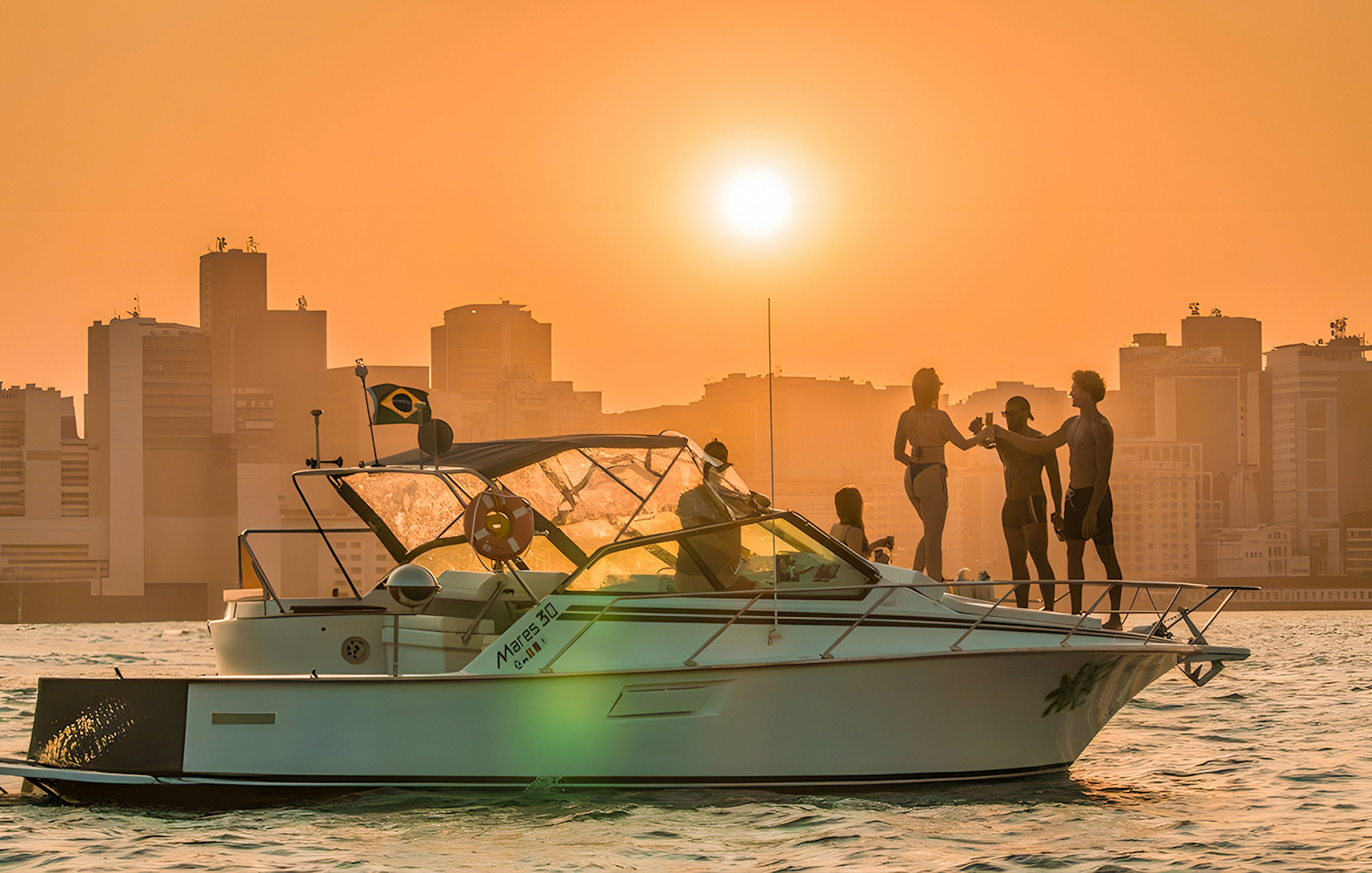 Tourists enjoying a sunset cruise in Rio de Janeiro with city skyline in the background.