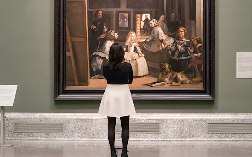Visitors viewing Velázquez's "Las Meninas" at Prado Museum, Madrid, Spain.