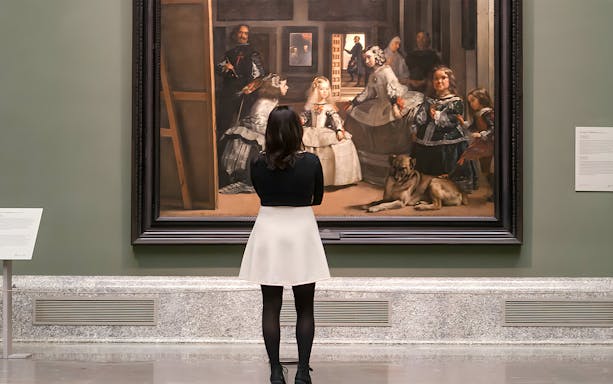 Visitors viewing Velázquez's "Las Meninas" at Prado Museum, Madrid, Spain.