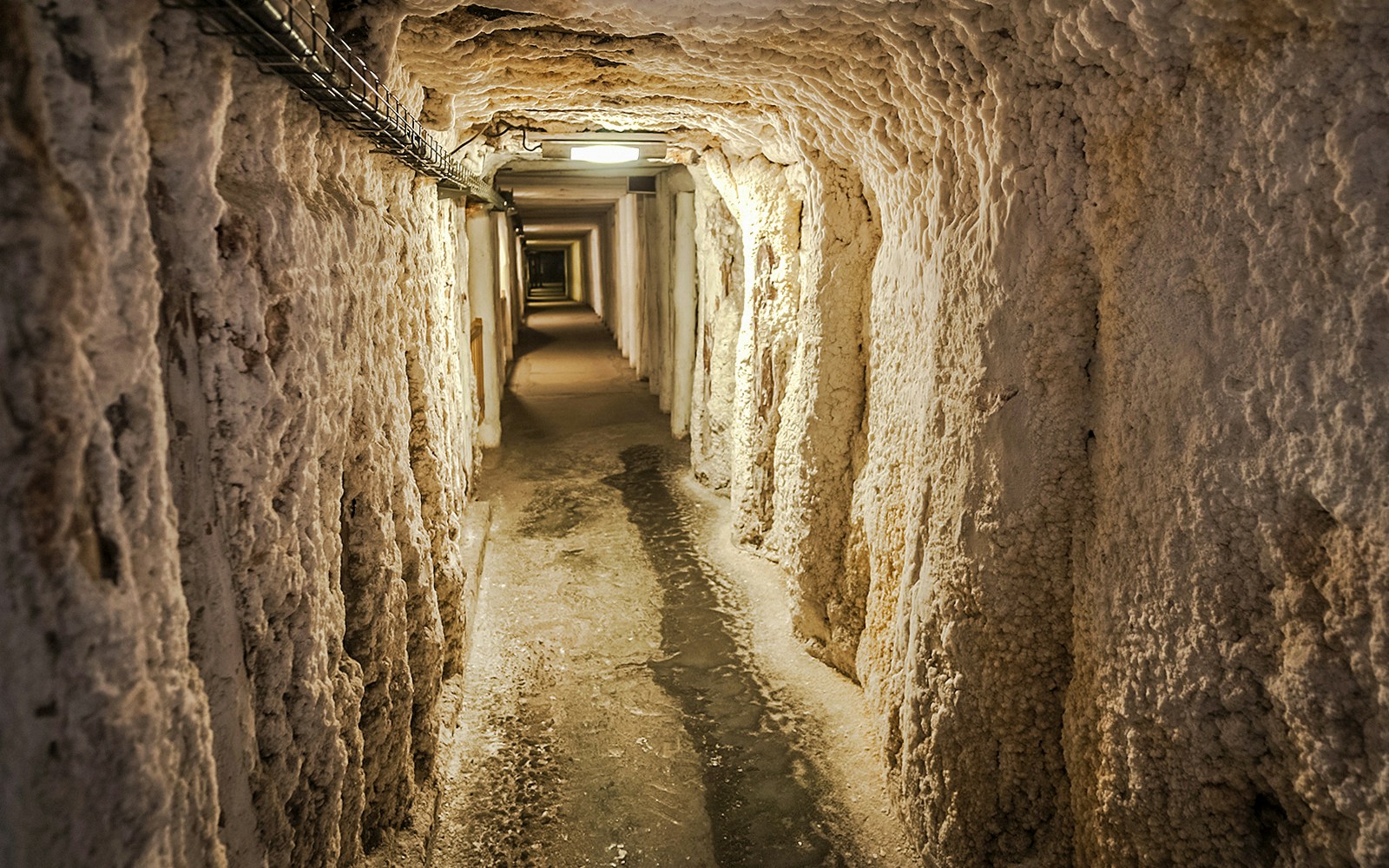 Wieliczka Salt Mine underground passageway with textured salt walls.