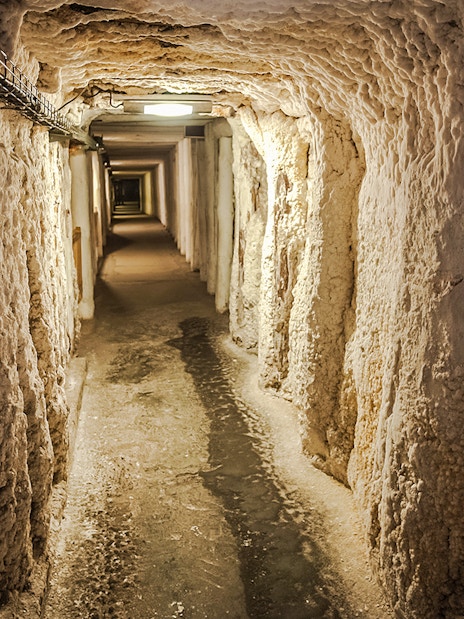 Wieliczka Salt Mine underground passageway with textured salt walls.