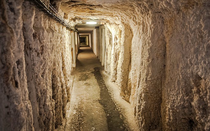 Wieliczka Salt Mine underground passageway with textured salt walls.