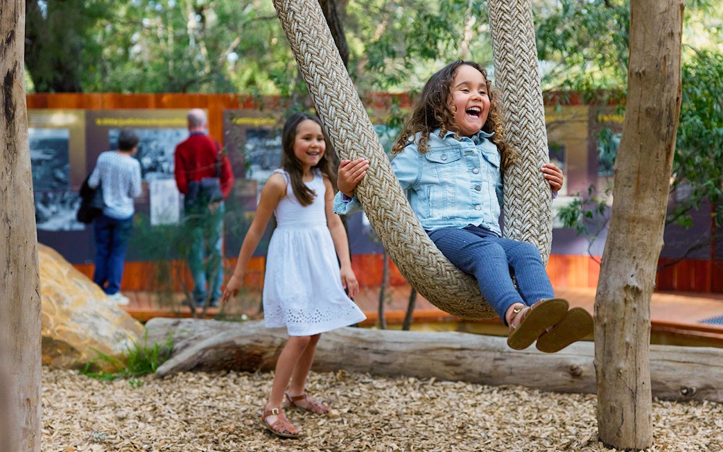 Children playing on a rope swing at Ngilgi Cave Ancient Lands Experience.