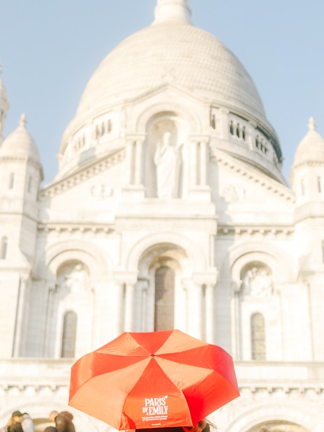 Sacre-Coeur Basilica with red umbrella, Montmartre Walking Tour, Paris.
