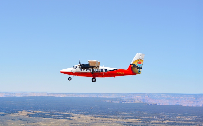 Twin Otter aircraft flying over the Grand Canyon, Arizona.