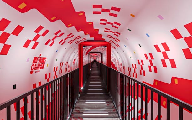 Tunnel with red geometric patterns at Mind Games - Art Alive! exhibit.