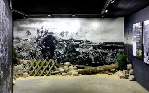 Berlin Story Bunker exhibit with historical wartime scene and artifacts.