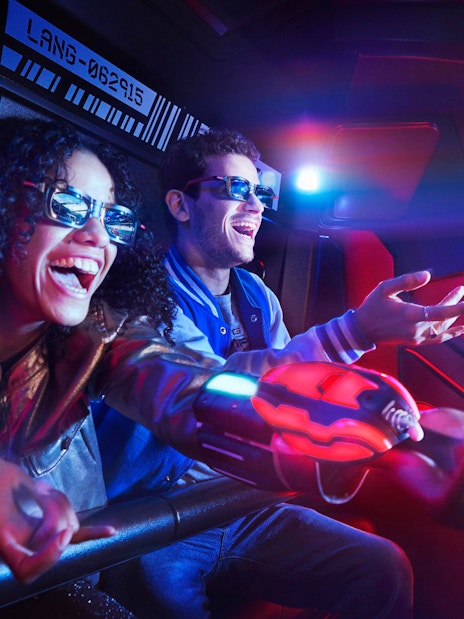 Visitors enjoying a 3D interactive ride at Disneyland® Paris.