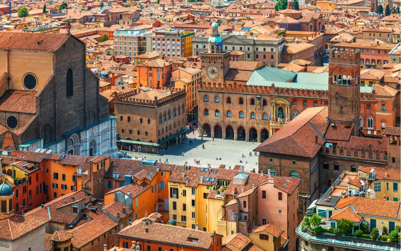 Aerial view of Piazza Maggiore and historic buildings in Bologna, Italy.