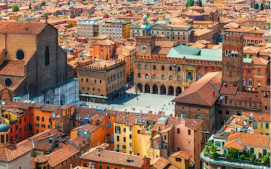 Aerial view of Piazza Maggiore and historic buildings in Bologna, Italy.