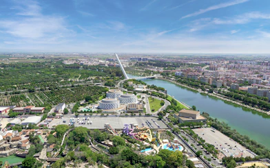 Aerial view of Isla Mágica theme park and surrounding Seville landscape.