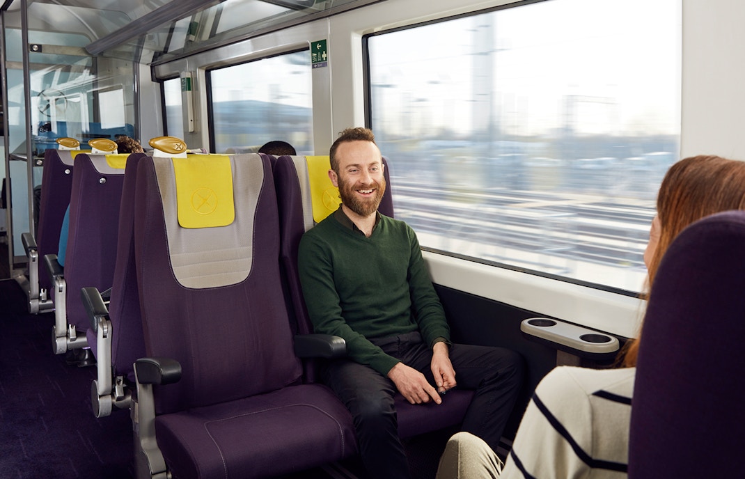 Passesngers chatting inside the train