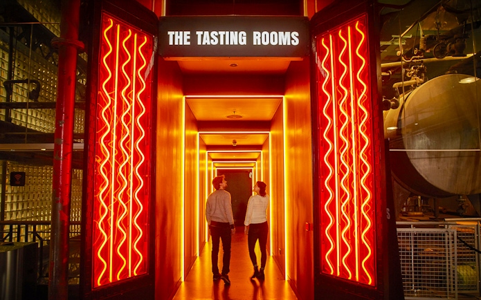 Visitors exploring the Tasting Rooms at Guinness Storehouse, Dublin.