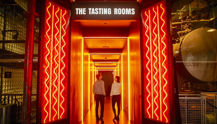 Visitors exploring exhibits at the Guinness Storehouse in Dublin, Ireland.