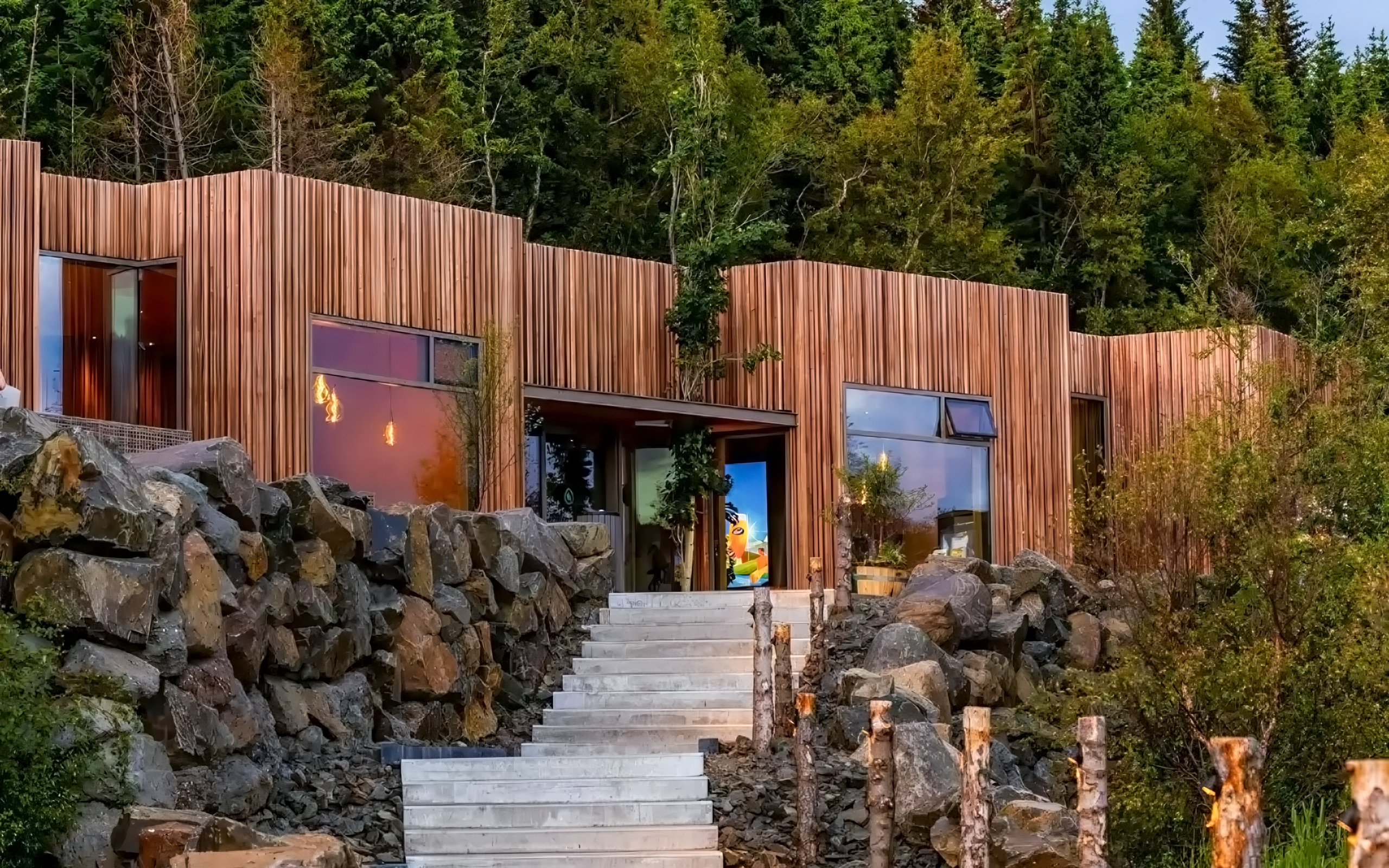 Forest Lagoon geothermal spa entrance surrounded by trees in Vaðlaskógur forest, near Akureyri, North Iceland.