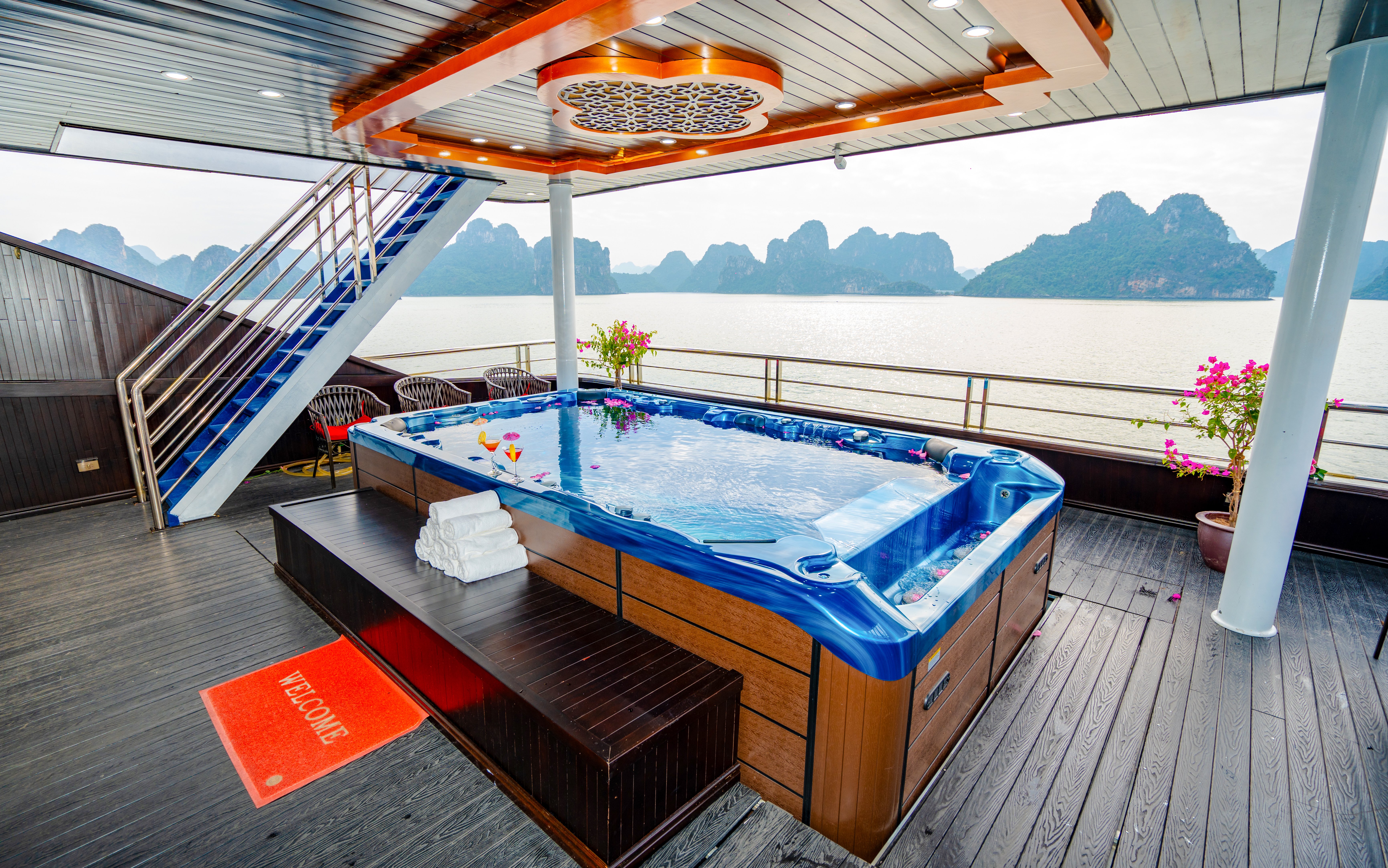 Jacuzzi with drinks on Phong Hai Harmony Cruise overlooking Ha Long Bay.