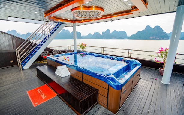 Jacuzzi with drinks on Phong Hai Harmony Cruise overlooking Ha Long Bay.