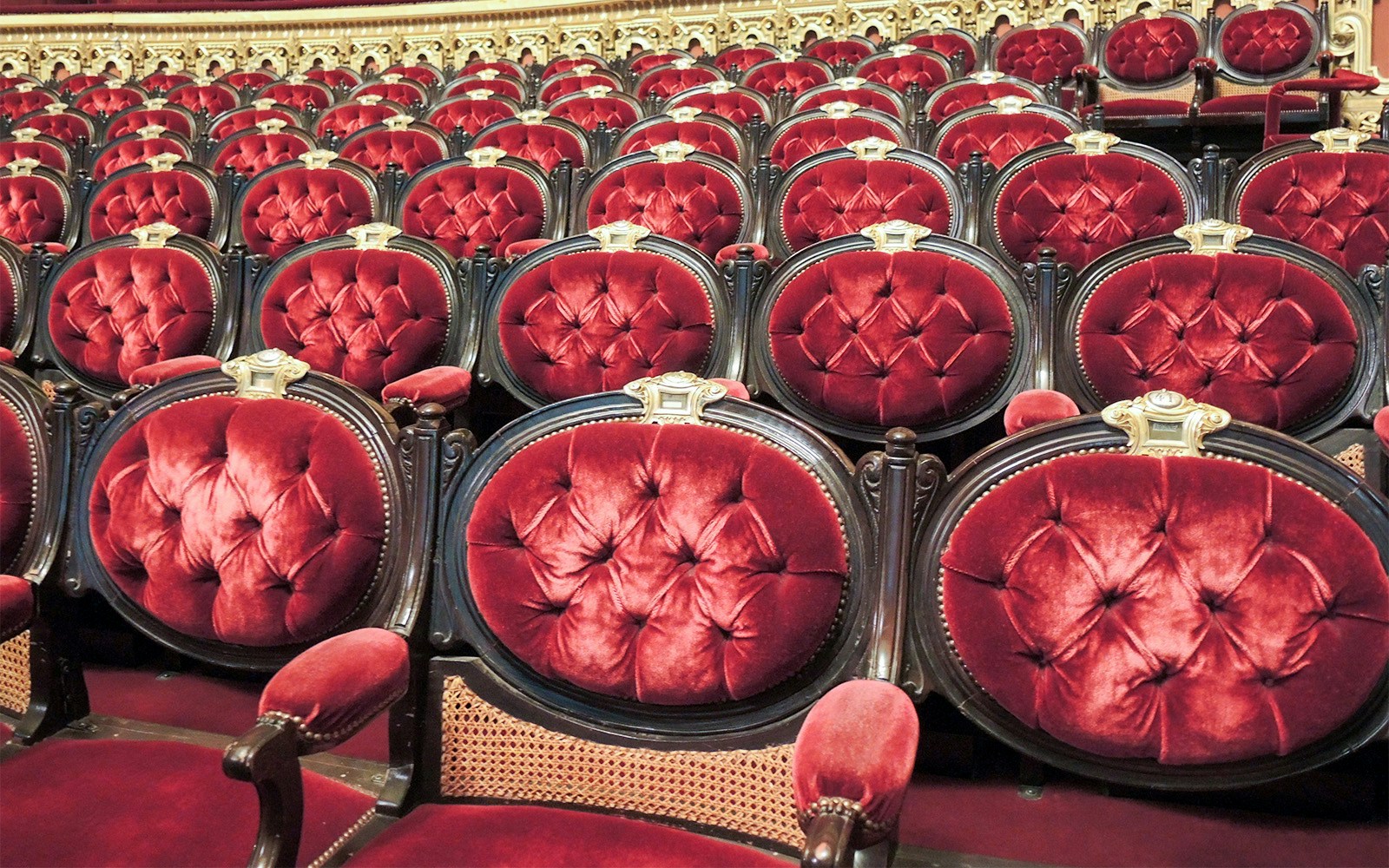 Red velvet seats in the auditorium of Opera Garnier, Paris.
