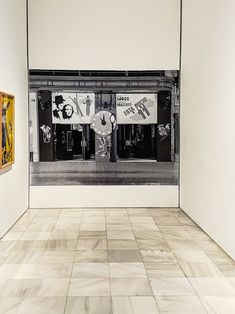 Art posters in a gallery at Reina Sofia Museum, Madrid, during guided tour.
