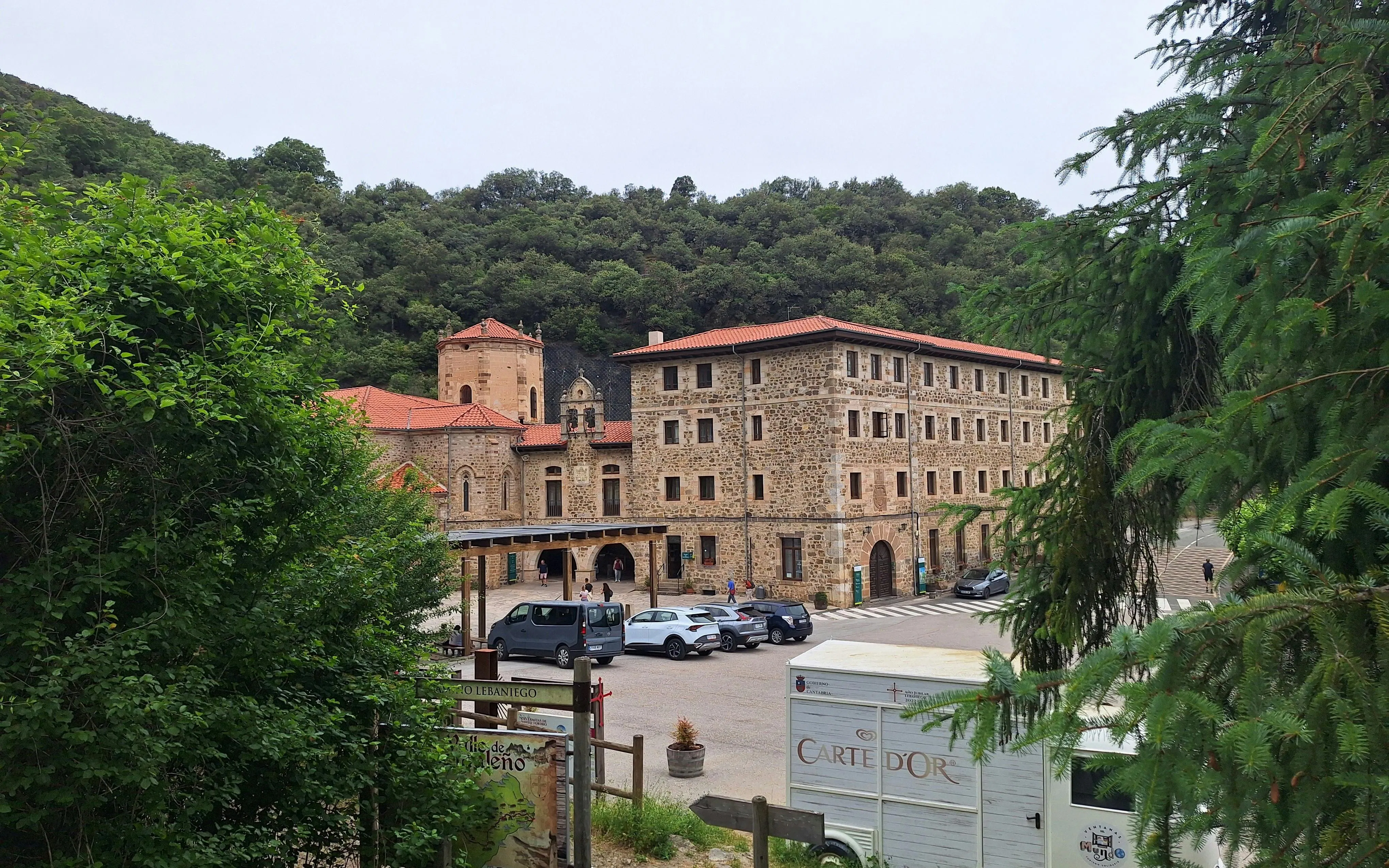 Monastery of Santo Toribio de Liébana near Potes, surrounded by lush greenery in Cantabria, Spain.
