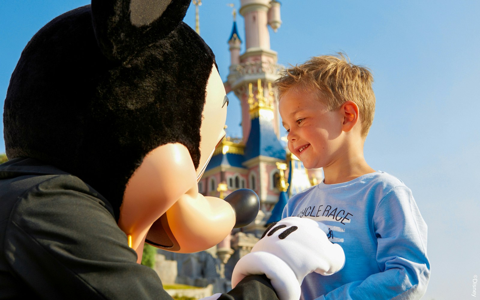 kid meeting Mickey Mouse at Disneyland Paris.