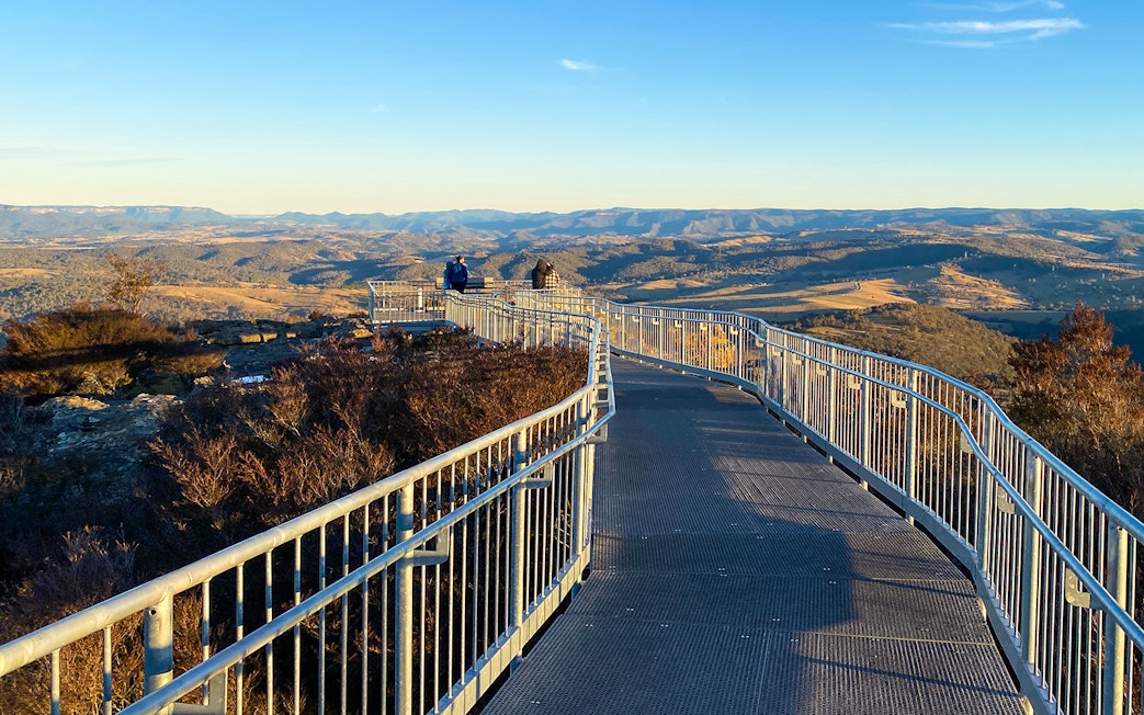 Boardwalk at Scenic World overlooking Blue Mountains landscape.