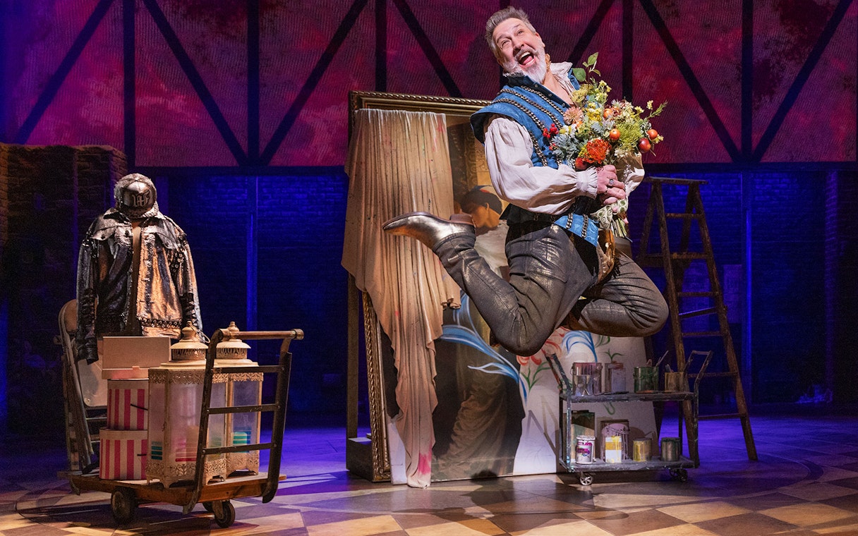 Performer jumping with flowers on stage during & Juliet musical.