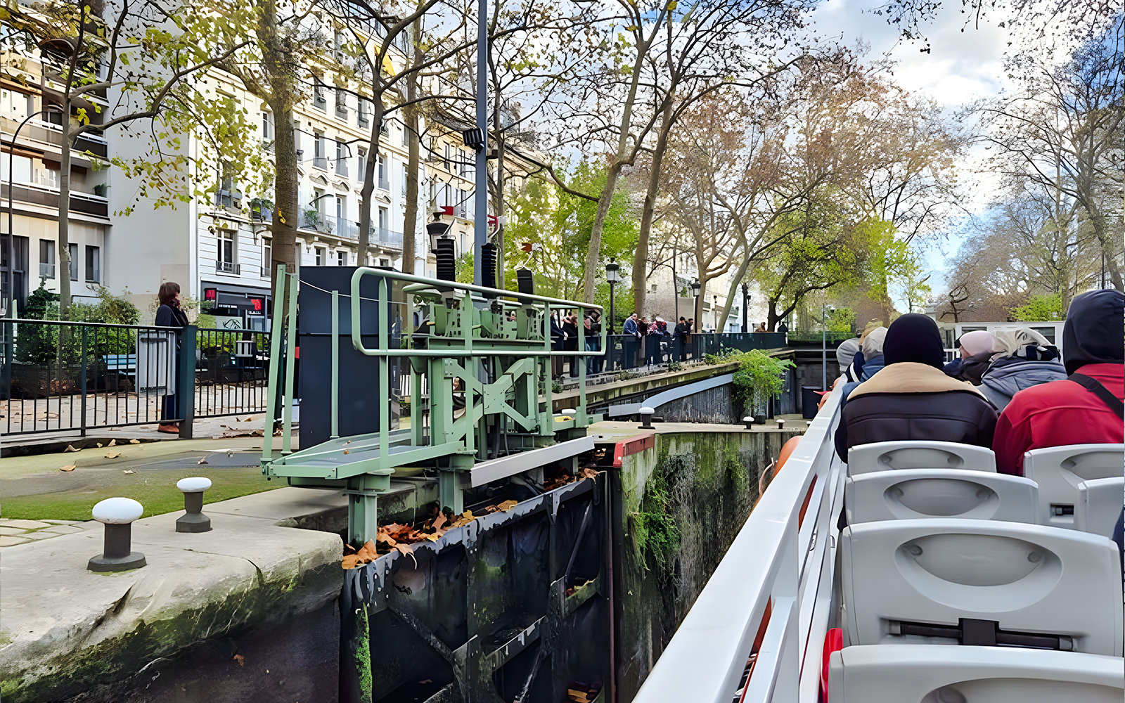 Seine River canal cruise boat passing through a lock in Paris, France.