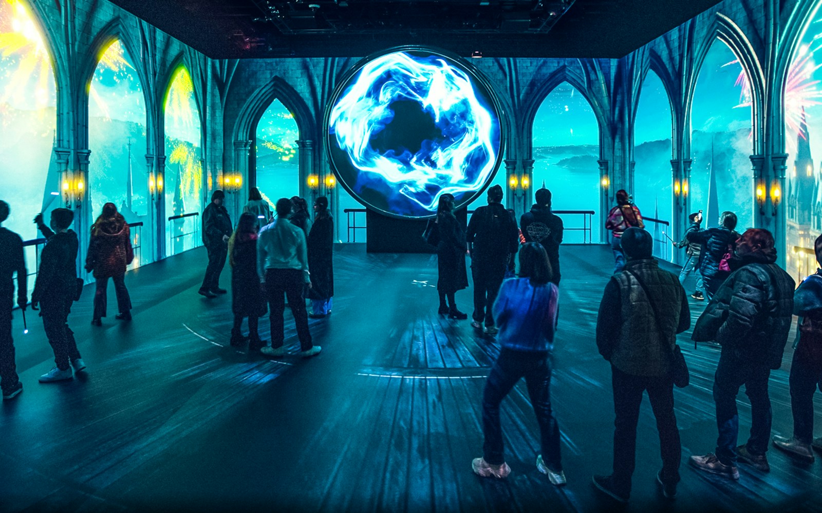Visitors exploring Pensieve exhibit at Harry Potter Visions of Magic Tokyo.