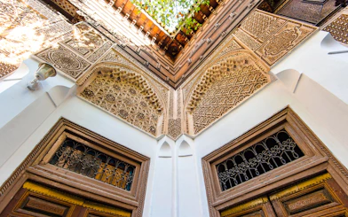 Bahia Palace intricate arch and carved wood details, Marrakech.