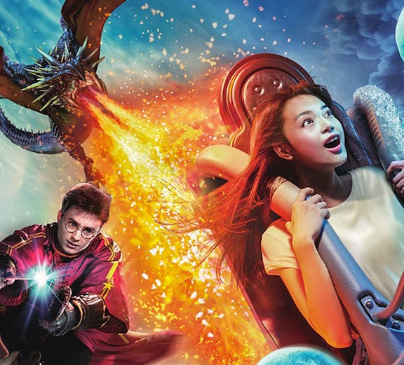 Universal Studios Japan ride with dragon and castle scene in Osaka.