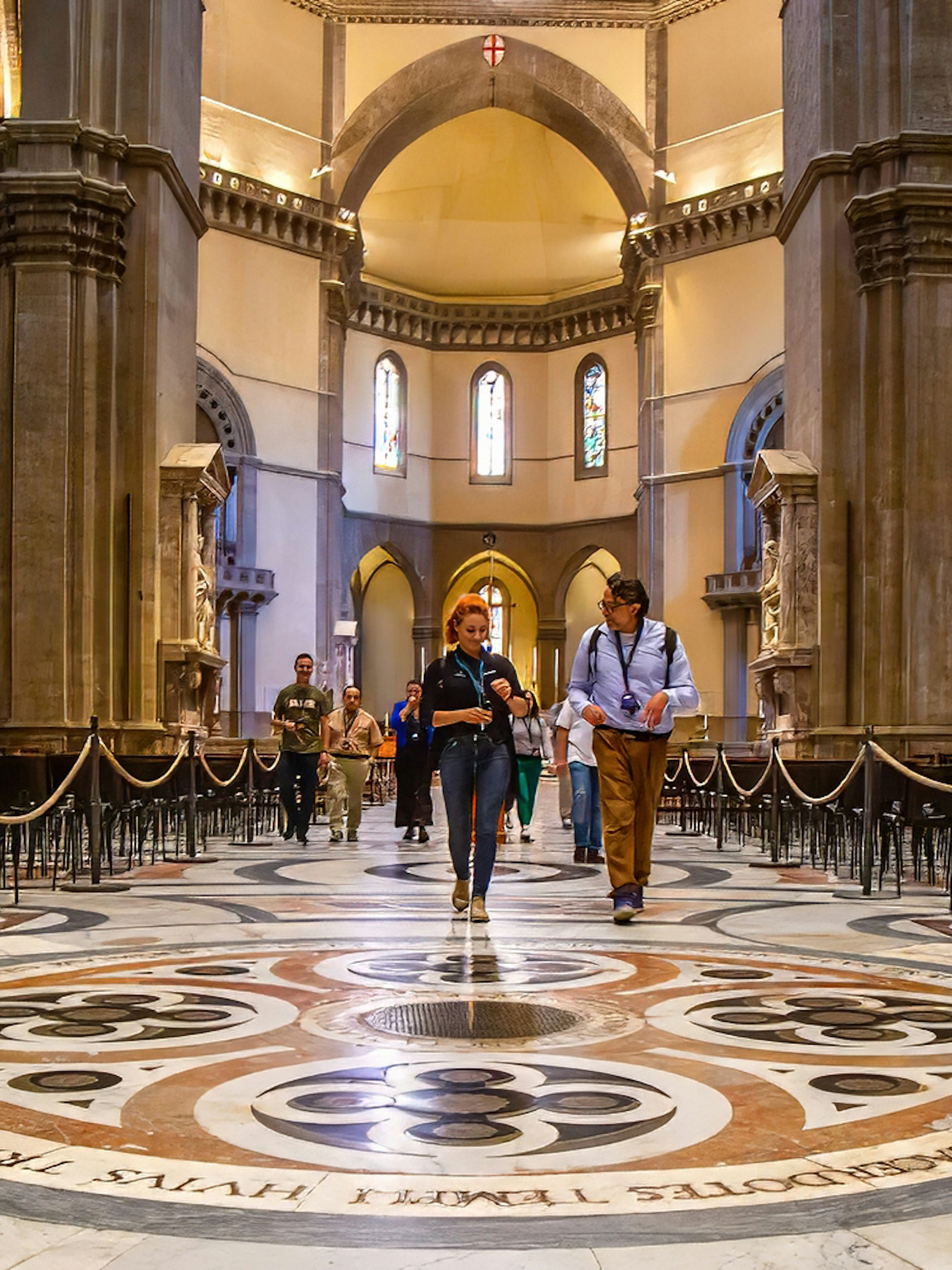 Visitors exploring the interior of Florence Duomo on a guided tour.