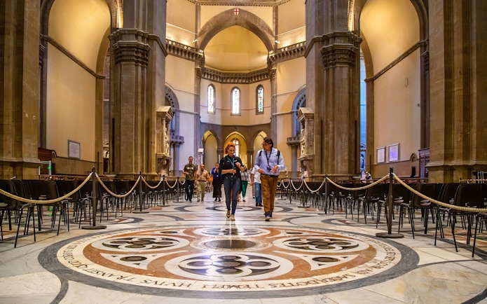 Visitors exploring the interior of Florence Duomo on a guided tour.
