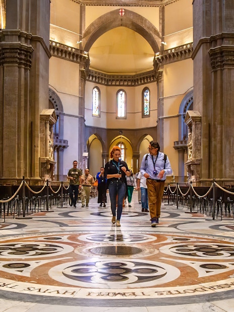 Visitors exploring the interior of Florence Duomo on a guided tour.