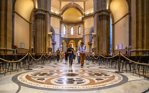 Visitors exploring the interior of Florence Duomo on a guided tour.