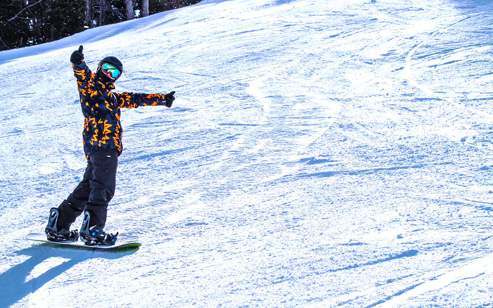 Skiers on snowy slopes at VallNord Ski Resort, Andorra, with mountain backdrop.