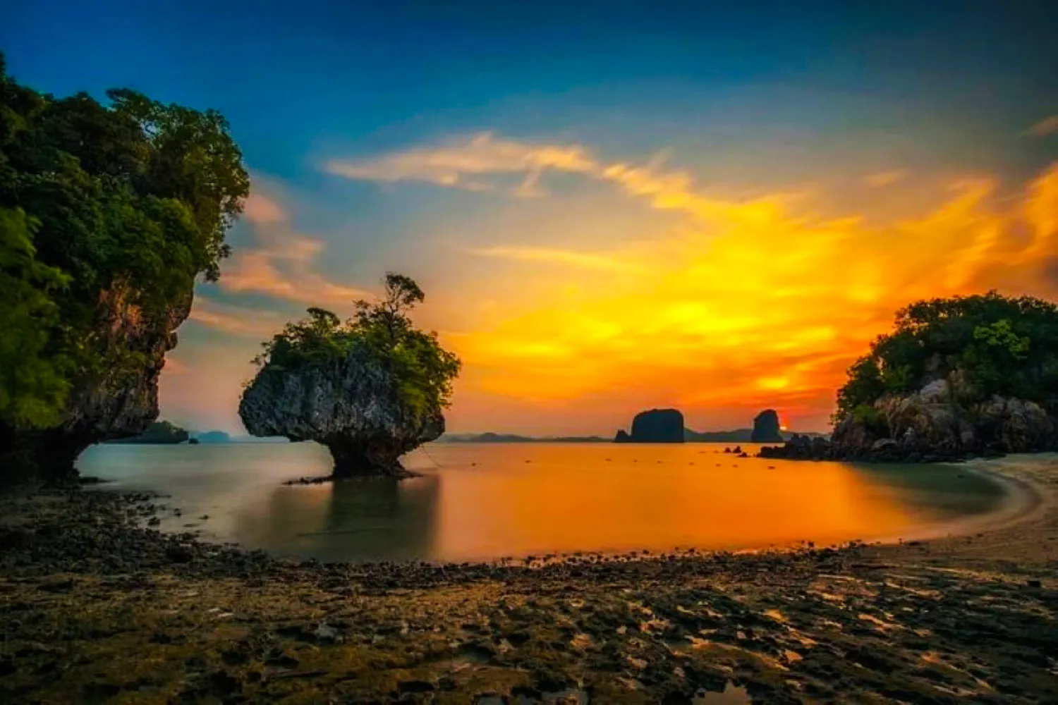 Sunset view of Hong Islands with limestone cliffs and calm sea, Krabi.