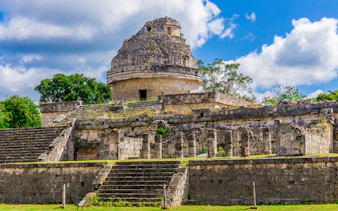 Weathered Mayan observatory at Chichen Itza, Mexico with stone steps and columns.