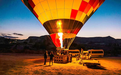 Hot air balloon being prepared for flight at sunrise in Cappadocia, Turkey.