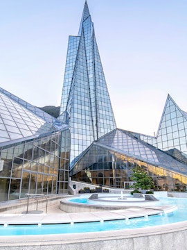 Caldea SPA glass building with outdoor pool in Andorra.