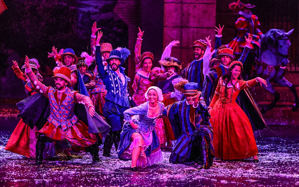 Performers in colorful period costumes during The Dream of Toledo Night Show.
