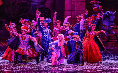 Performers in colorful period costumes during The Dream of Toledo Night Show.