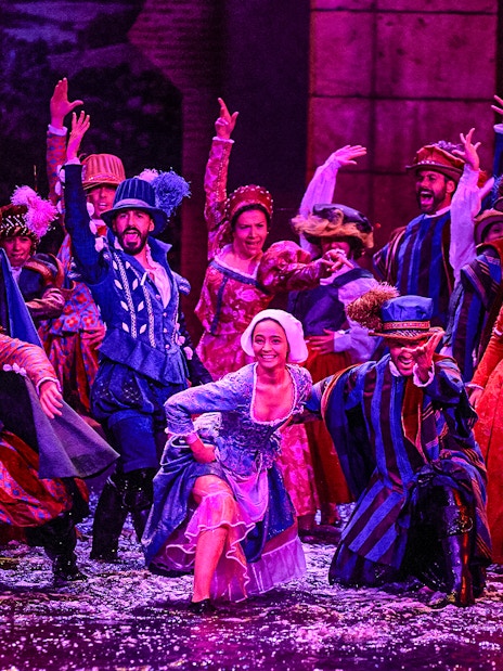 Performers in colorful period costumes during The Dream of Toledo Night Show.