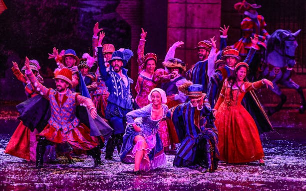 Performers in colorful period costumes during The Dream of Toledo Night Show.