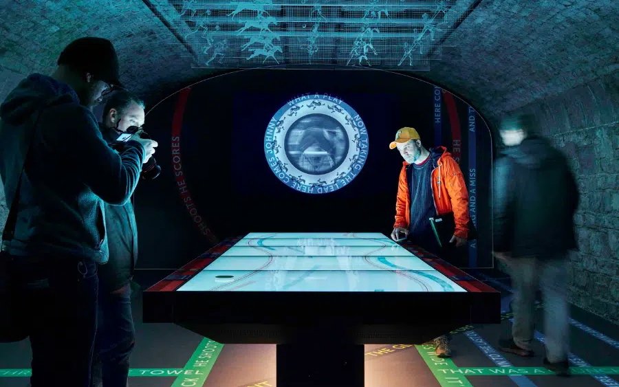 Visitors interacting with a digital exhibit at EPIC Museum, Dublin.