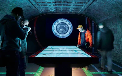 Visitors interacting with a digital exhibit at EPIC Museum, Dublin.