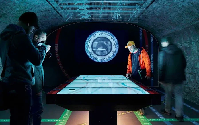 Visitors interacting with a digital exhibit at EPIC Museum, Dublin.